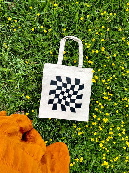 Dazed and Confused tote laying on grass