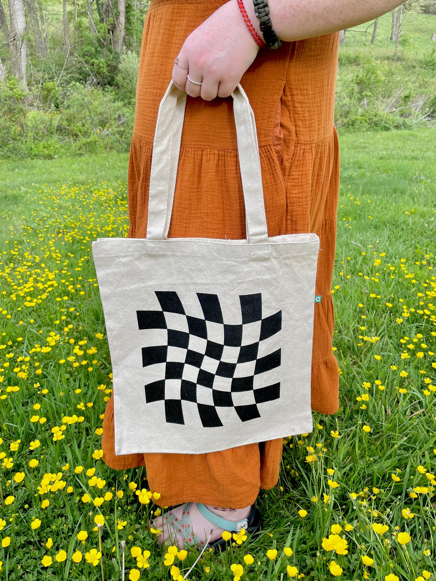 Girl holding Dazed and Confused tote by her side