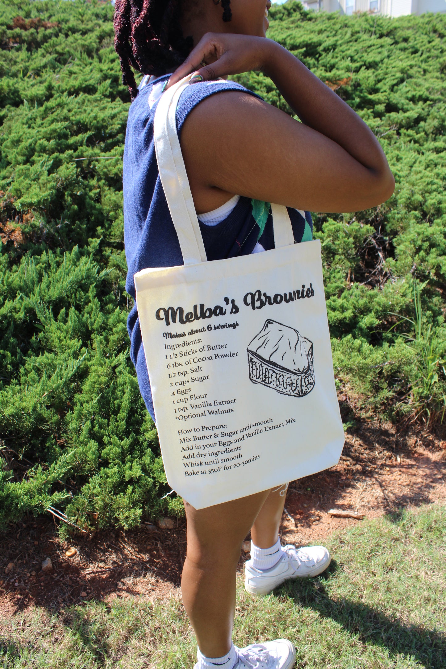 Girl with Melba's Brownies tote hanging over shoulder