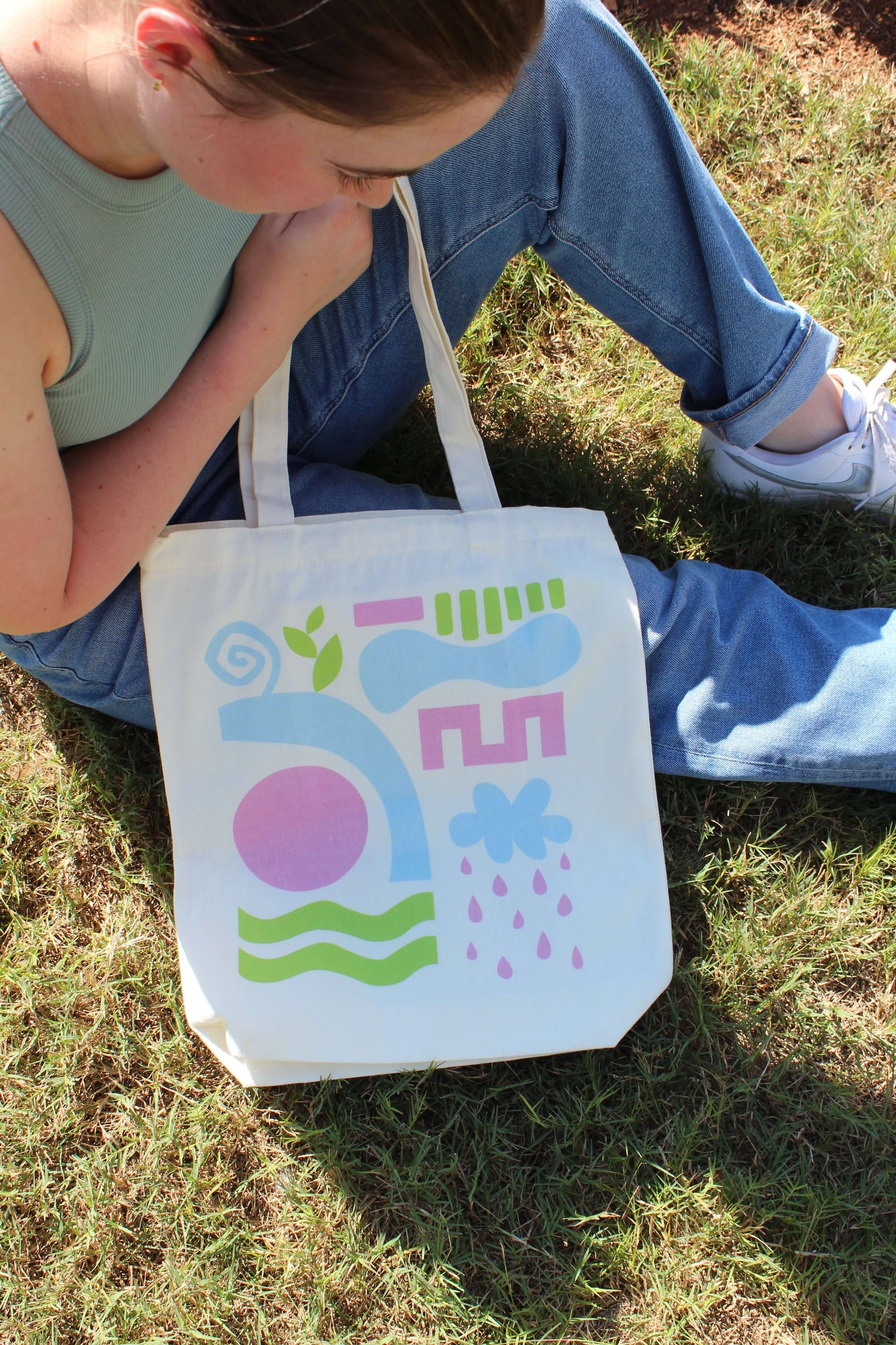 Girl sitting holding Abstract Tri Color Tote Bag