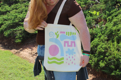 Abstract Tri Color Tote Bag hanging behind shoulder