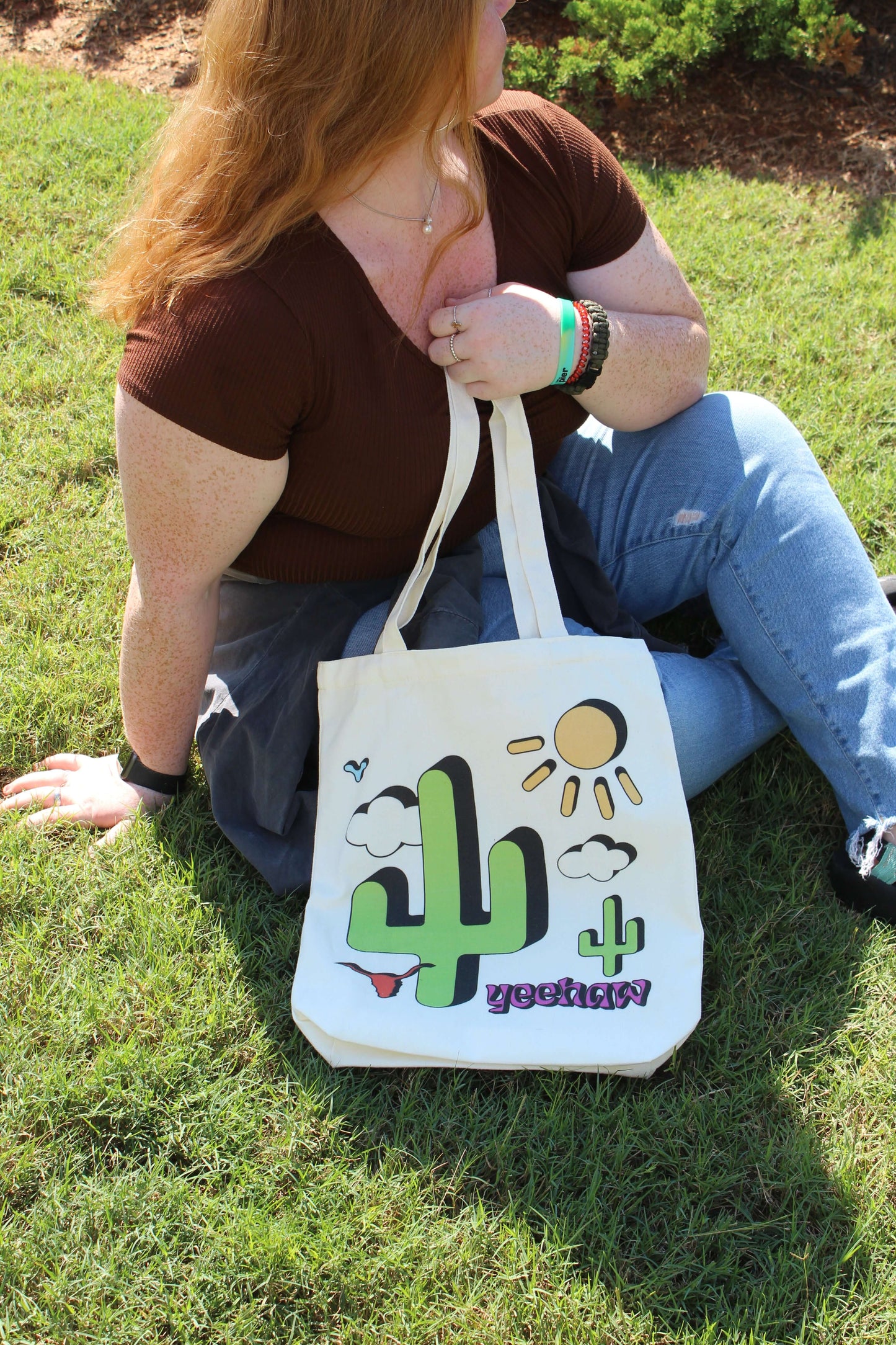 Girl sitting outside with Western Cowgirl tote in lap