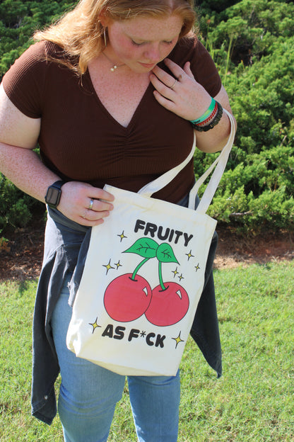 Girl looking down at Fruity AF tote