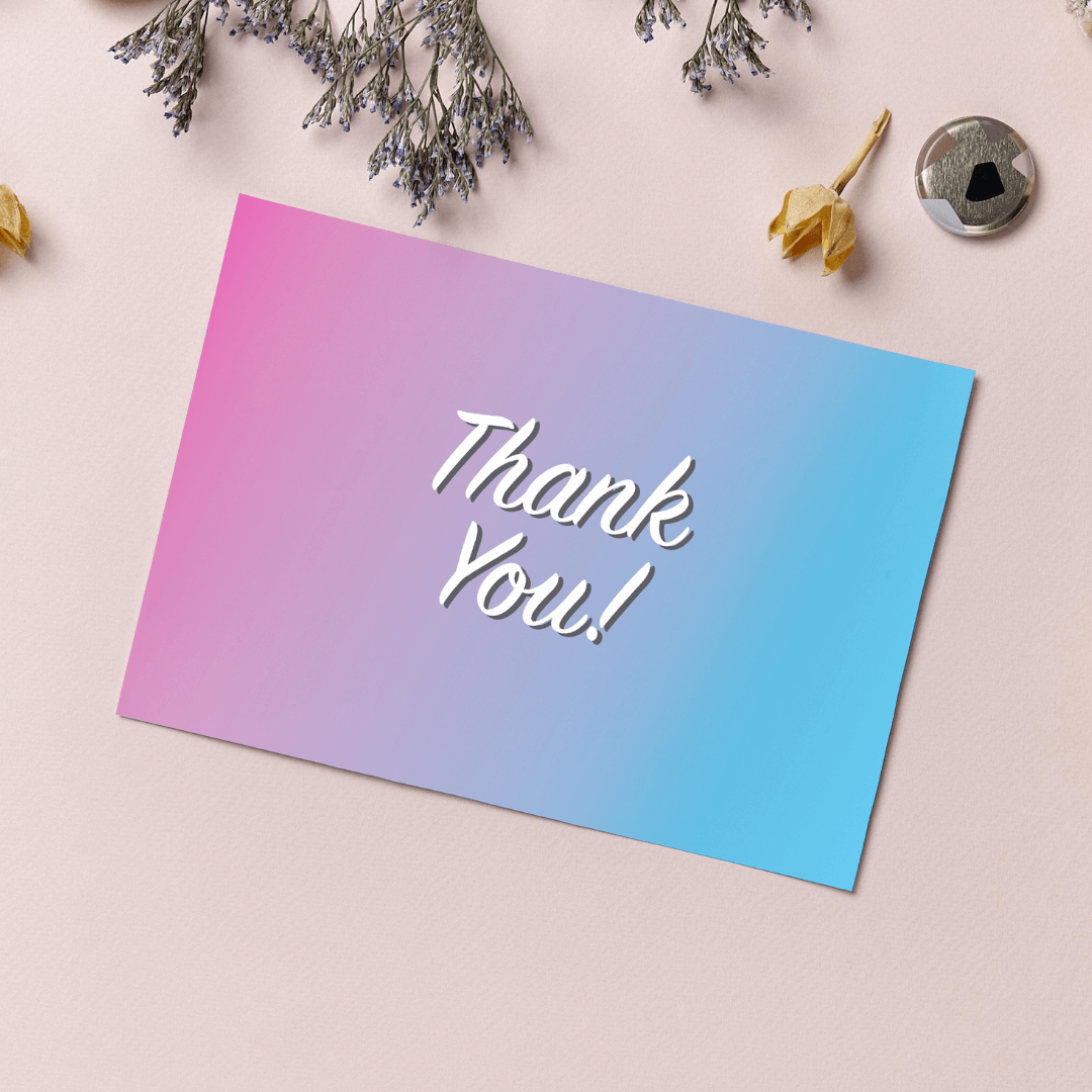 Blue and pink thank you card on desk